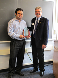 Dale Hoffman presenting the career award to Arnab Roy