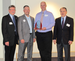 Dale Hoffman, Paul Mittan, Ben Campbell, Kultegin Aydin posing with Campell's career award