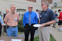 alumni and faculty members standing outside and talking during the student alumni mixer