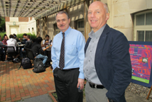 faculty members standing outside and talking during the student alumni mixer